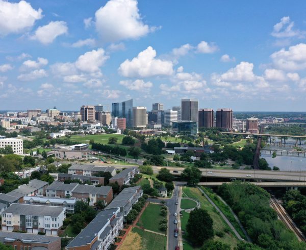 A beautiful shot of Richmond, Virginia skyline with a cloudy blue sky in the background