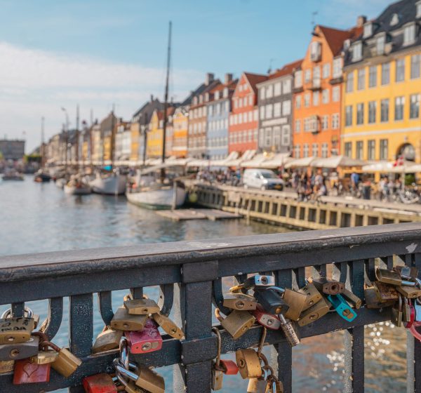 A beautiful view of a canal, colorful buildings in Nyhavn, Copenhagen, Denmark