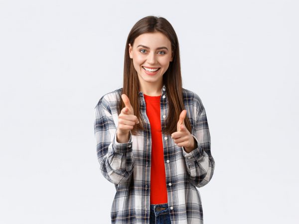 Lifestyle, different emotions, leisure activities concept. Enthusiastic and happy young pretty girl in casual outfit pointing fingers at camera, gotcha or congratulations gesture, choosing you.