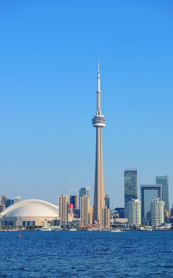 Toronto skyline panorama over lake with urban architecture.