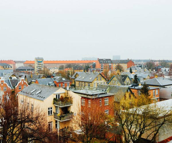 A wide shot of houses and buildings in the city of Copenhagen, Denmark