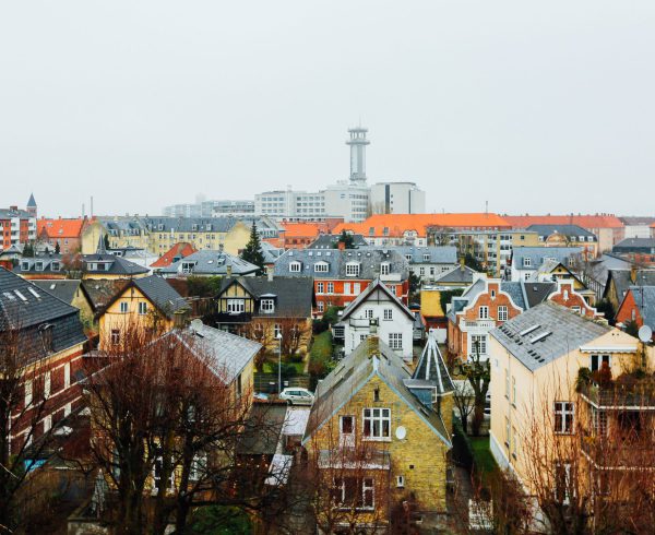 A wide shot of houses and buildings in the city of Copenhagen, Denmark